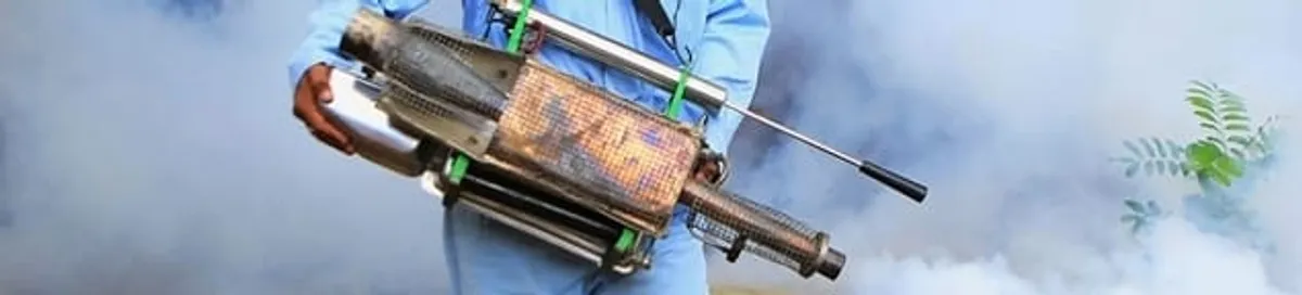 Fumigation technician using a fogger for deep pest treatment in Richmond, VA